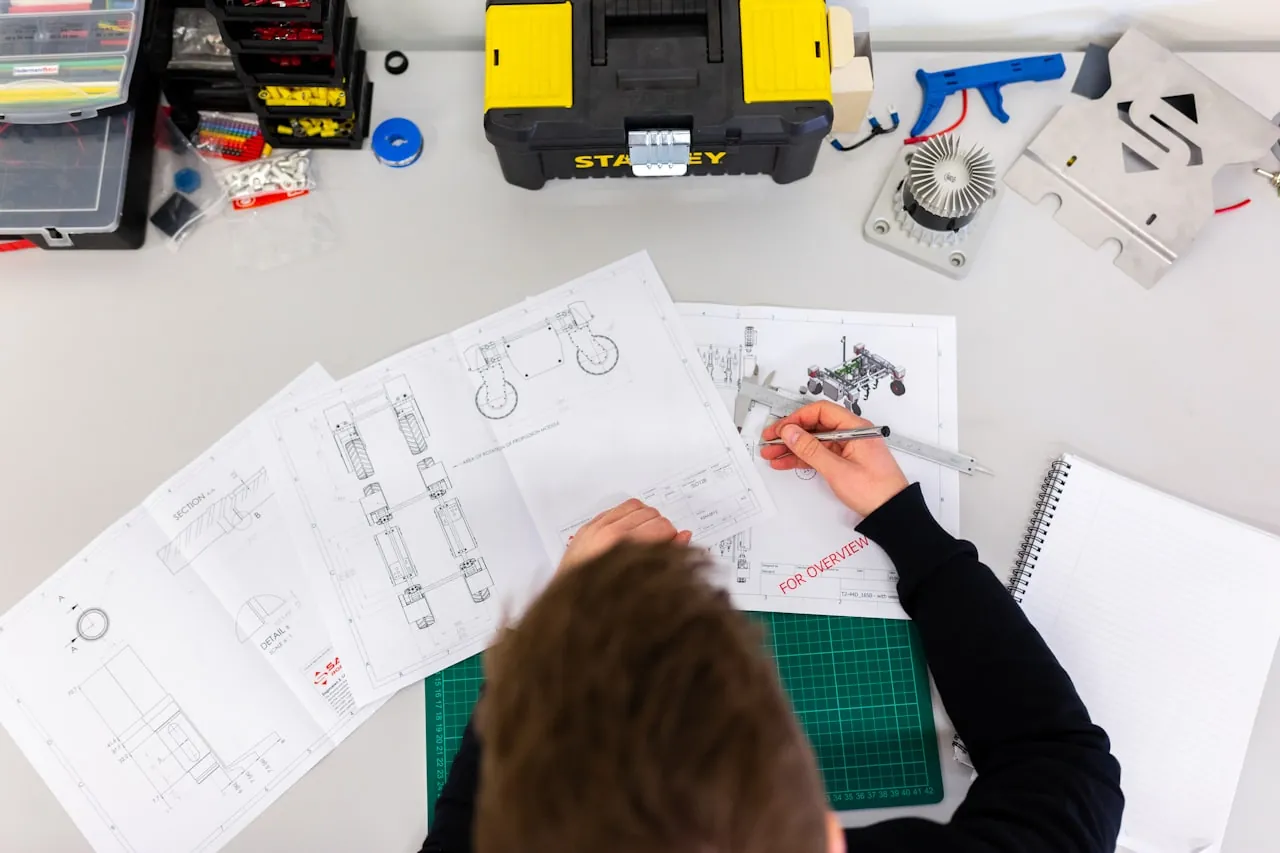 Engineer working from technical drawings